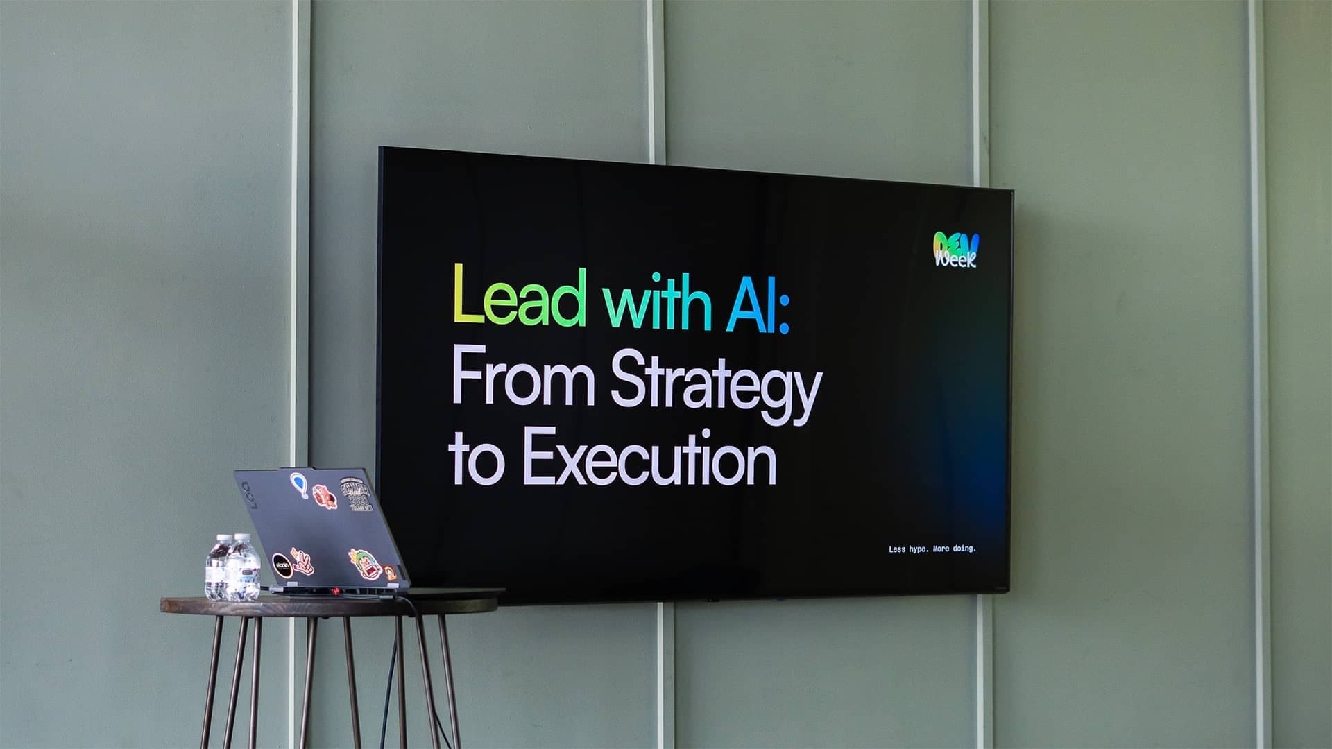 Workshop slide on a TV: Lead with AI, From Strategy to Execution