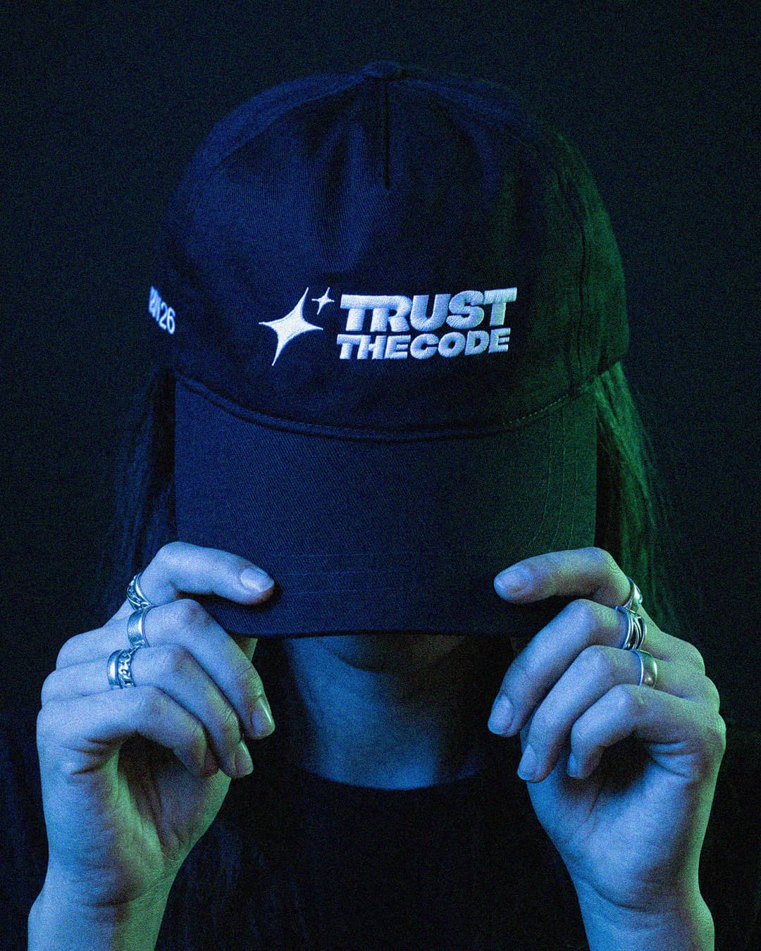 AI-generated Trust the Code cap