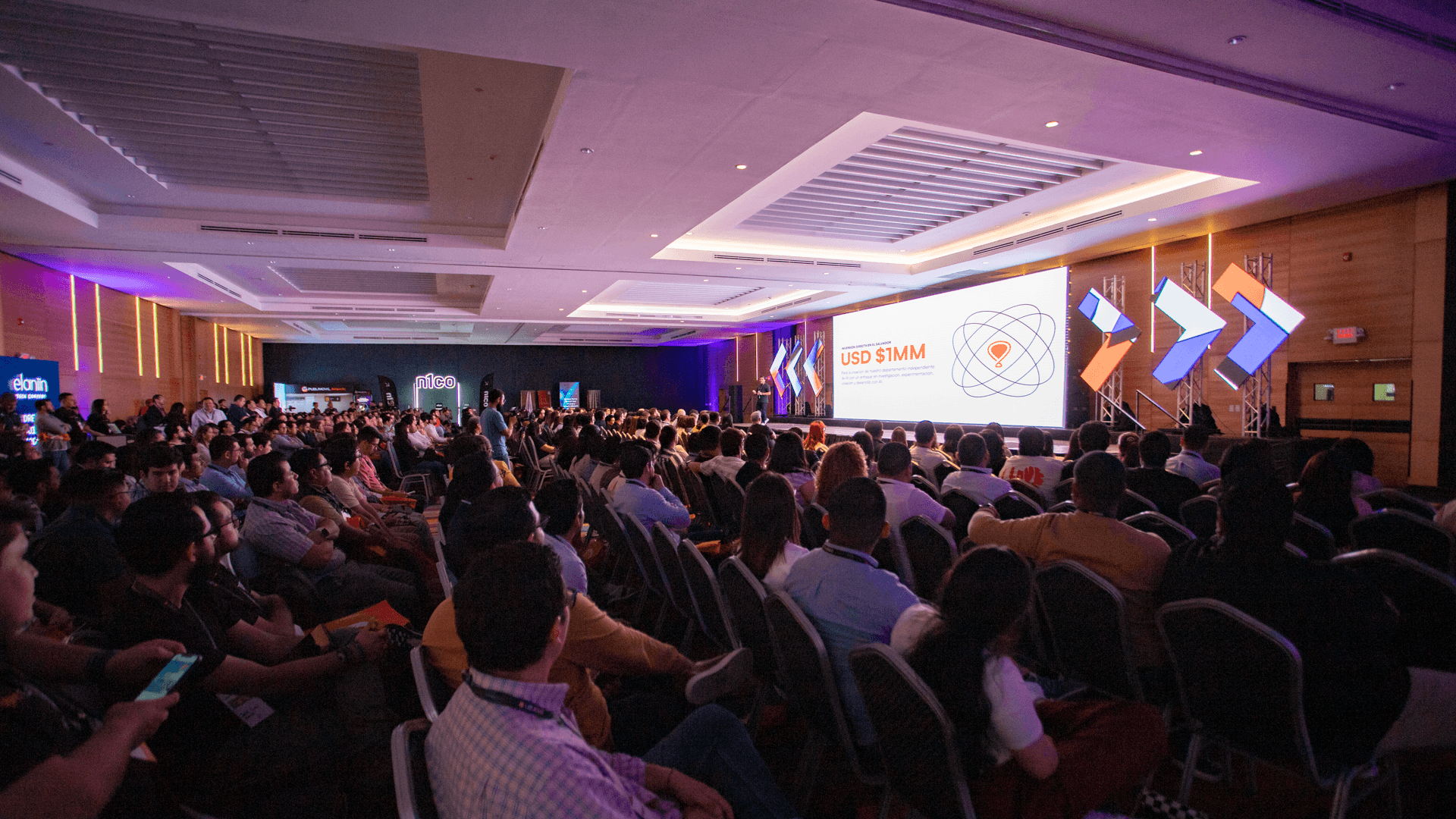 Elaniin AI '24 full auditorium with USD $1MM investment slide