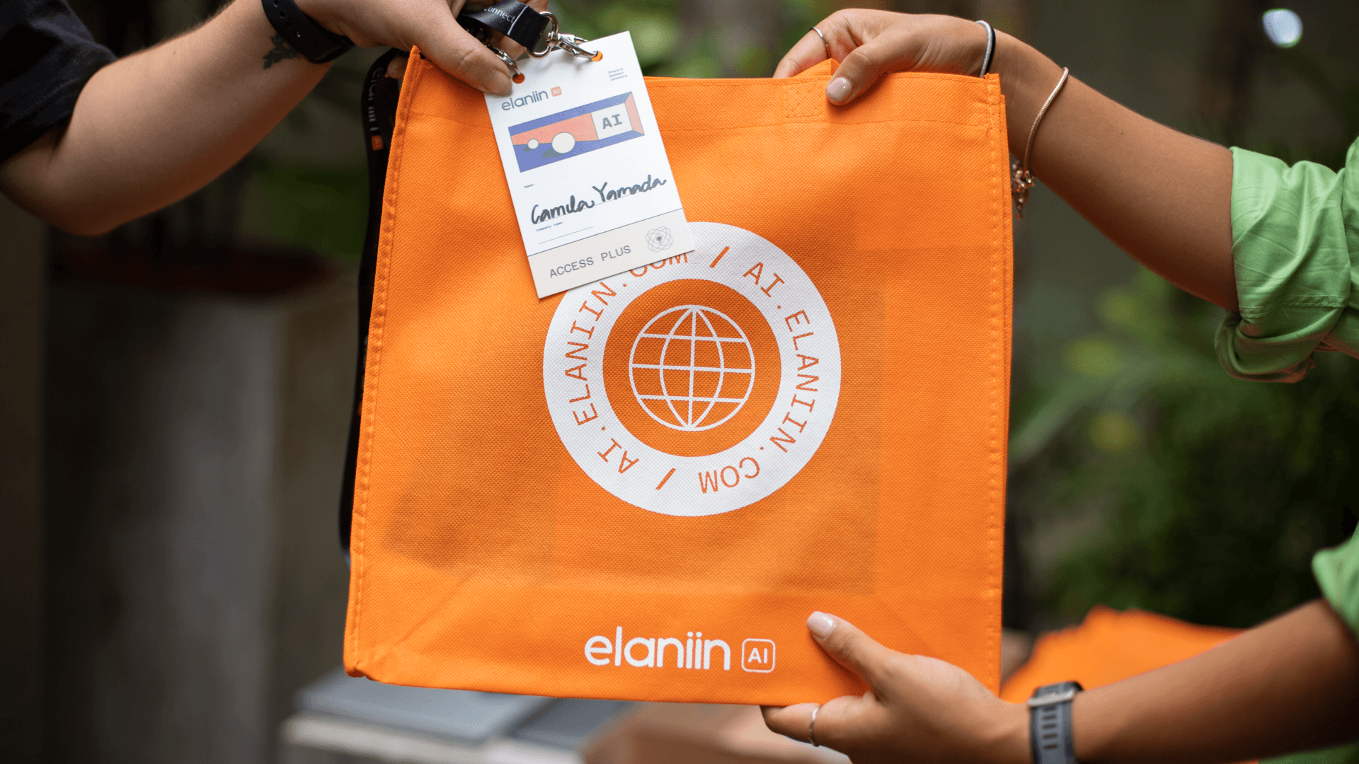 Elaniin AI '24 welcome bag handoff